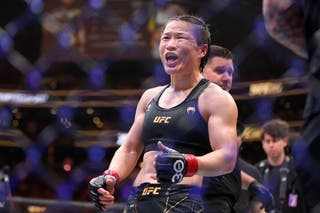 Zhang Weili celebrating a successful title defence at strawweight